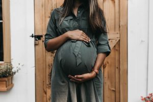 woman holding her pregnant belly